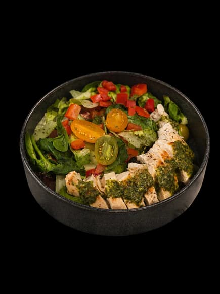 Zesty cilantro salad with chicken, corn, tomatoes, pumpkin seeds, and red bell peppers